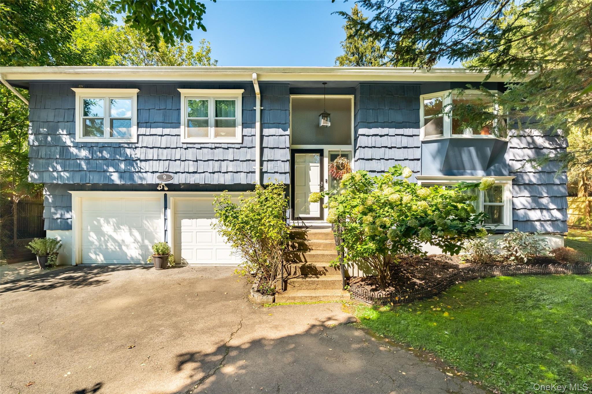 Welcome to 9 Brookdale Drive in Hartsdale, a beautifully renovated rai...