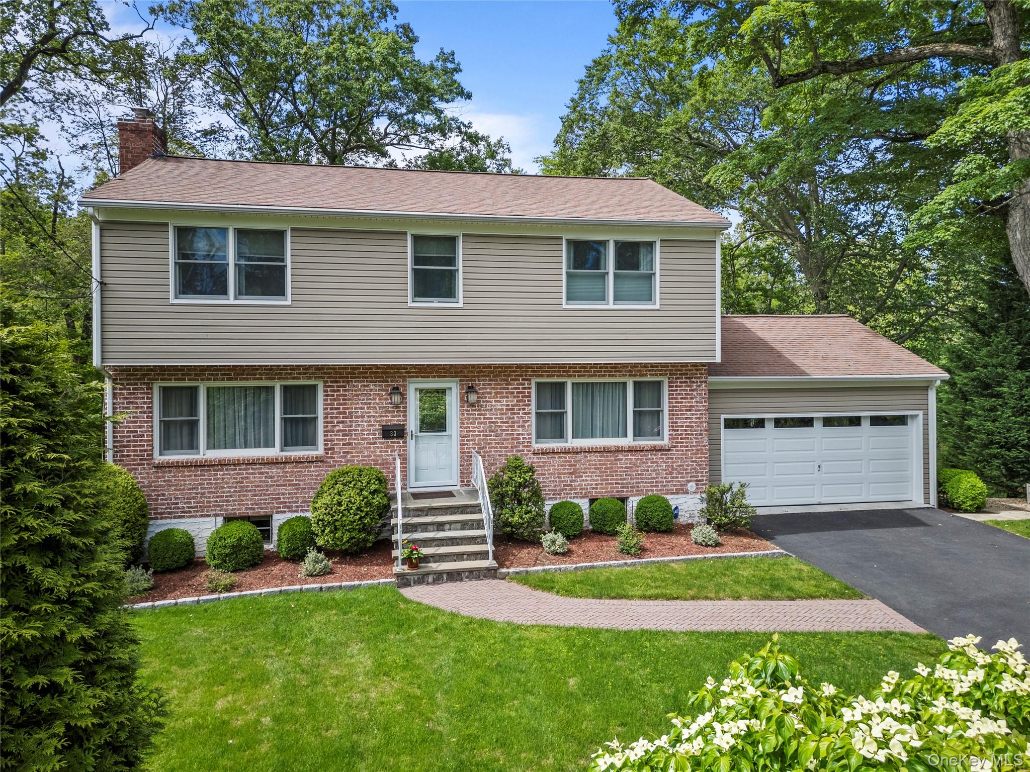 Conveniently situated  on a quiet, tree-lined street in highly sought-...