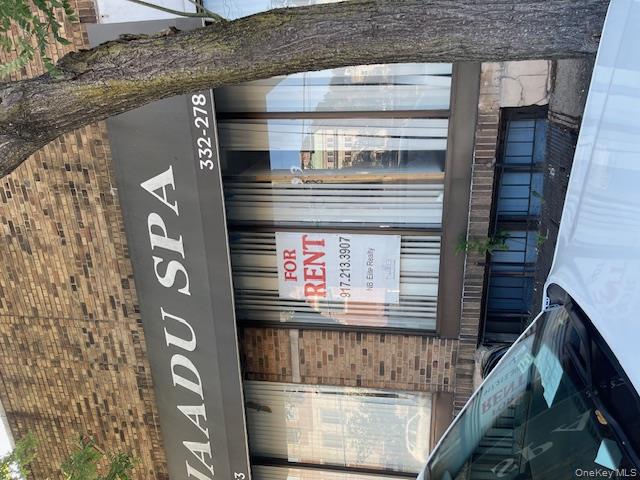 The property is situated in a commercial stretch: there are storefront...