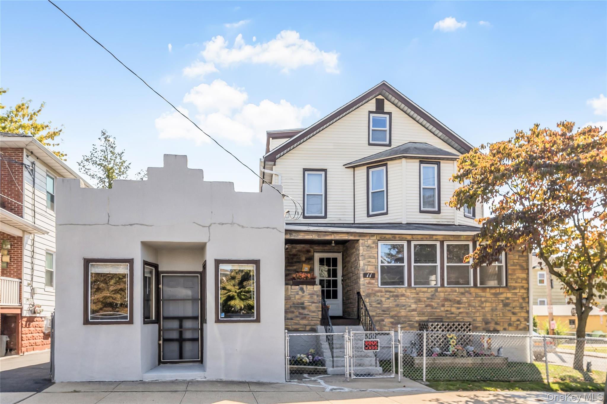 Versatile 2 family home with an attached store offers flexible spaces...