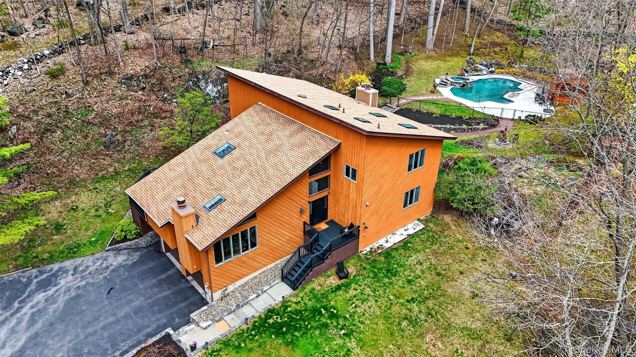 Tucked away at the end of a cul-de-sac, this architectural Contemporar...