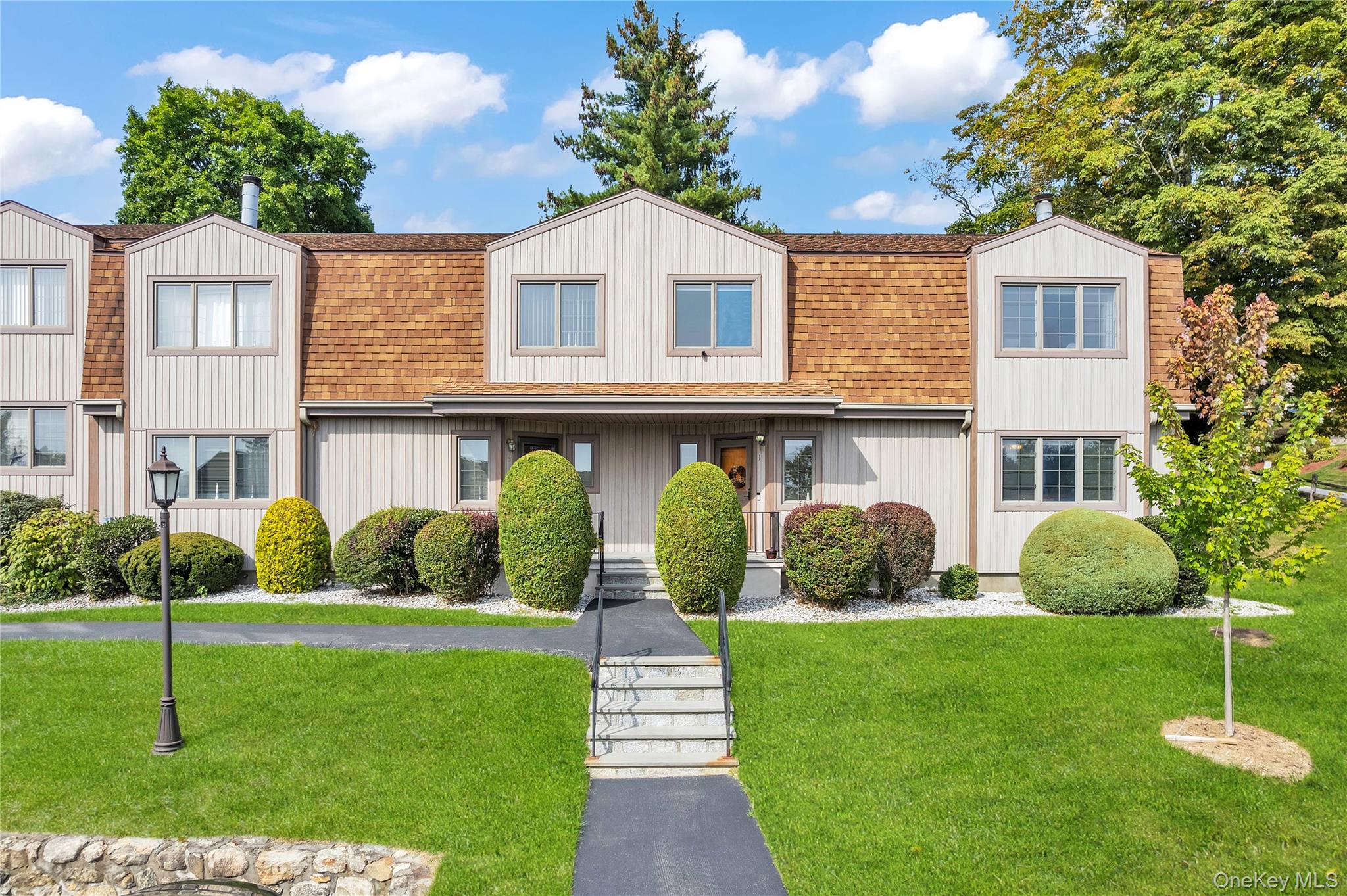 END-UNIT TOWNHOUSE in the desirable complex of The Meadows where comfo...