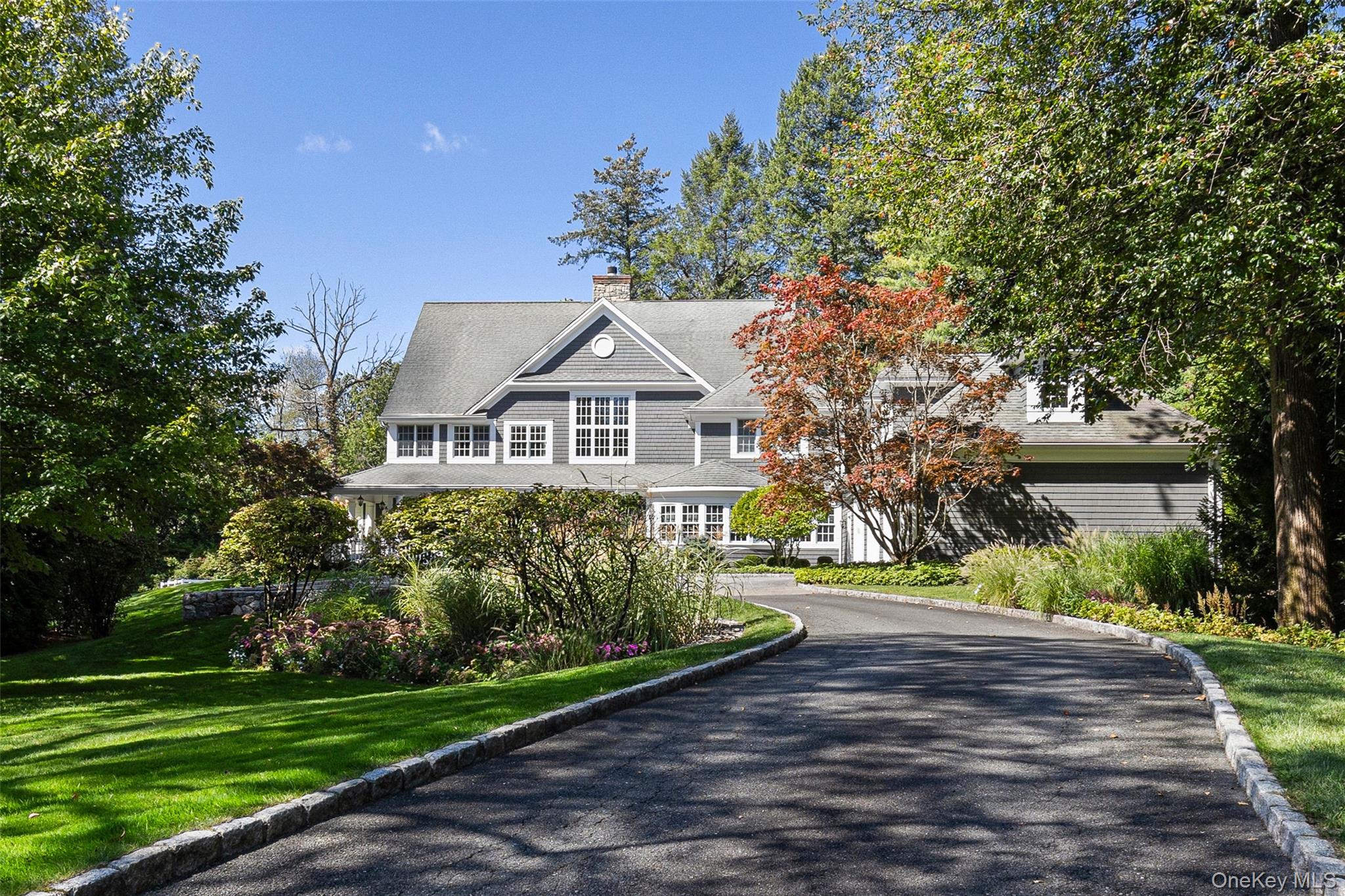 Nestled on 1.5 acres of beautifully landscaped, level grounds in the p...