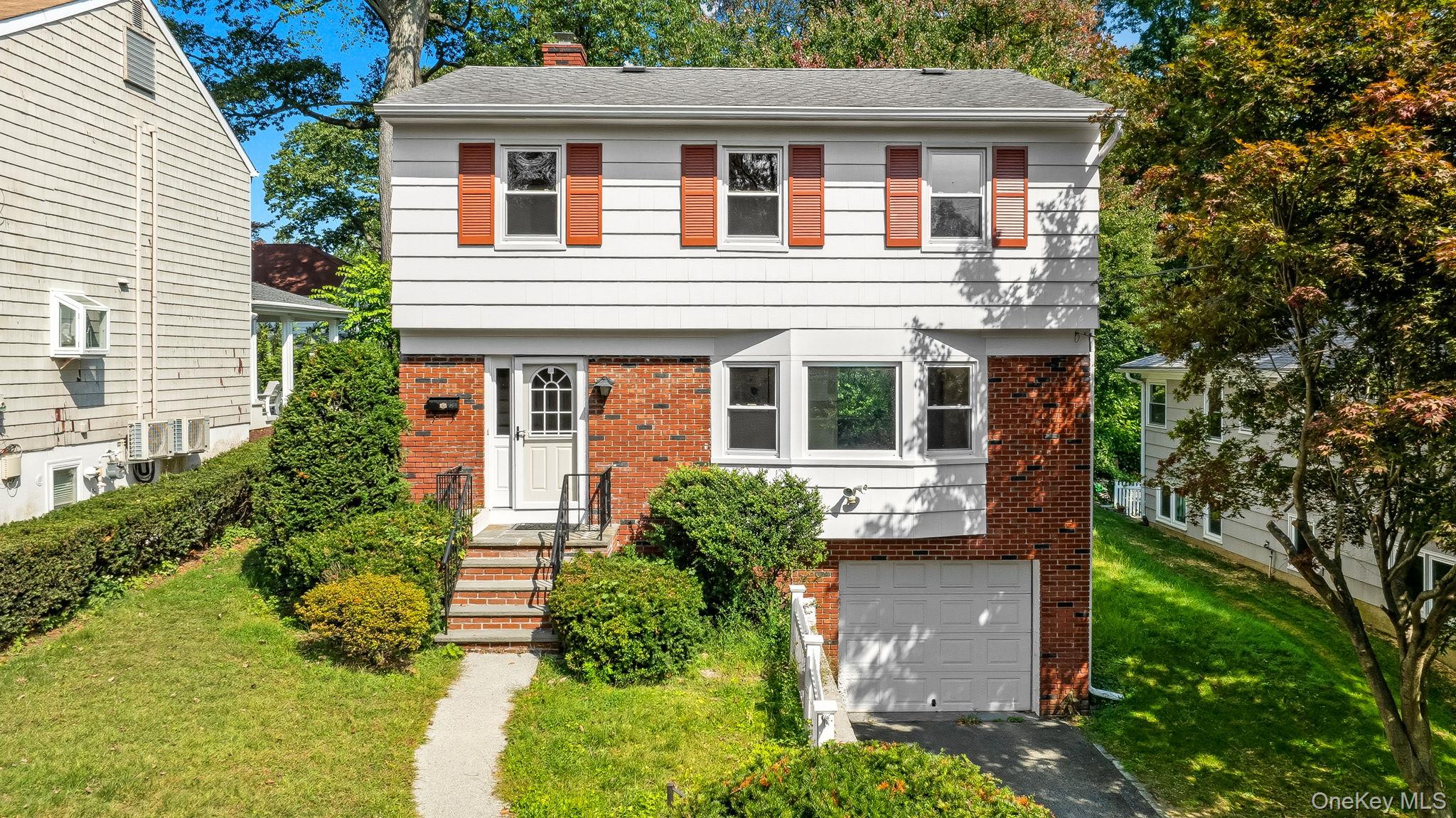 Welcome to 105 Sprague Road, a fabulous and centrally located Scarsdal...