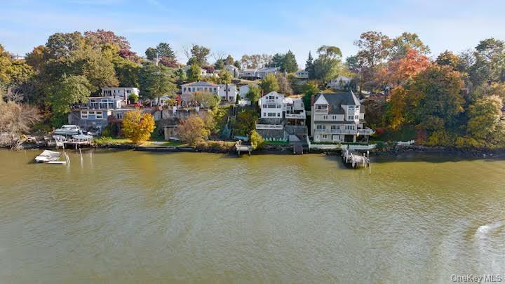 Wake up to panoramic Hudson River views in this stunning Verplanck wat...