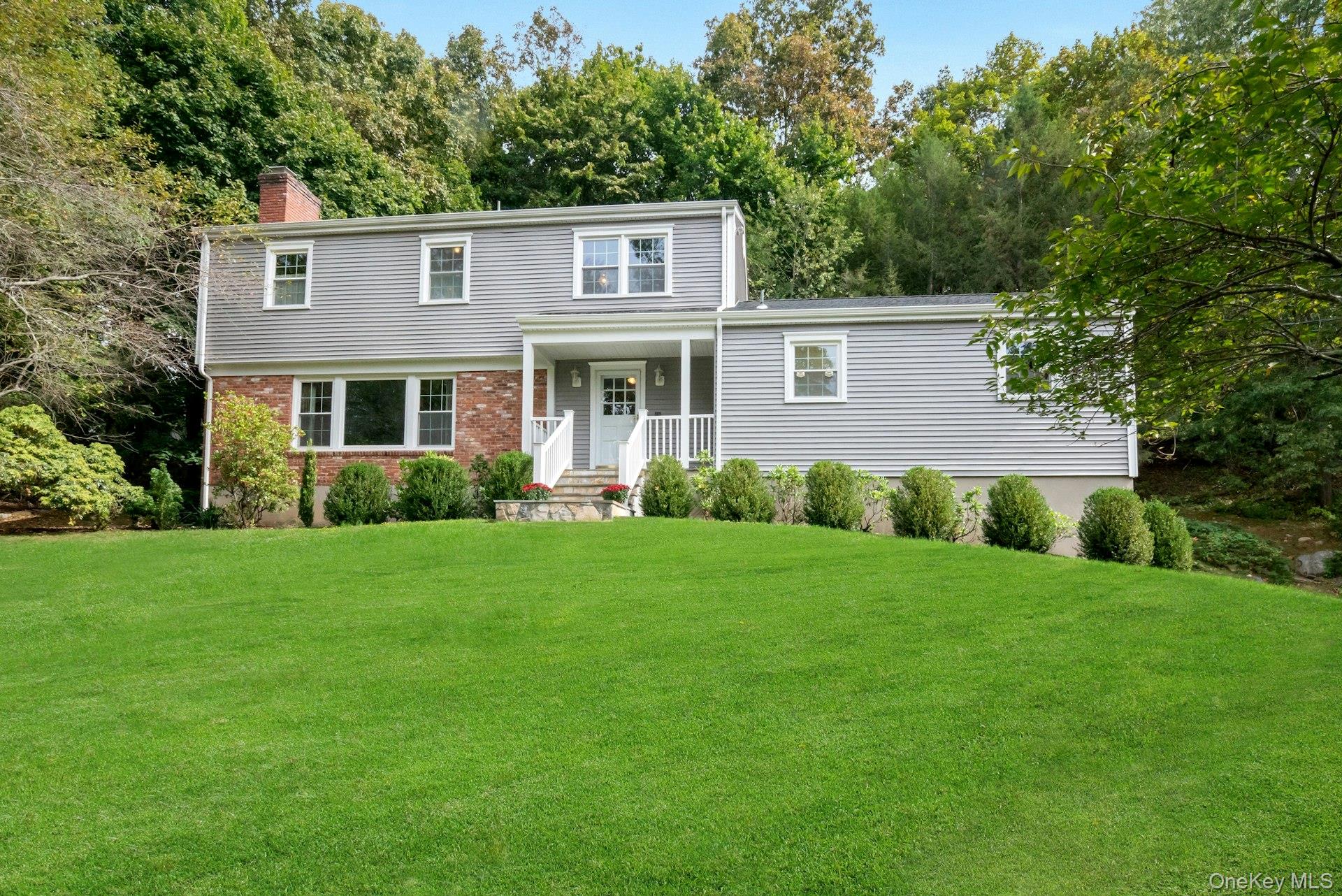Stately 4 Bedroom, 2 1/2 bathroom colonial set high on .94 acres at th...