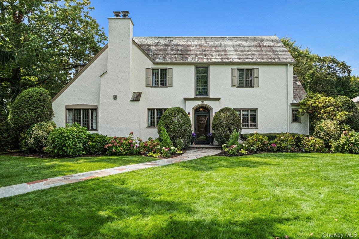 Modern vibe meets classic charm in this spectacular updated English Tu...