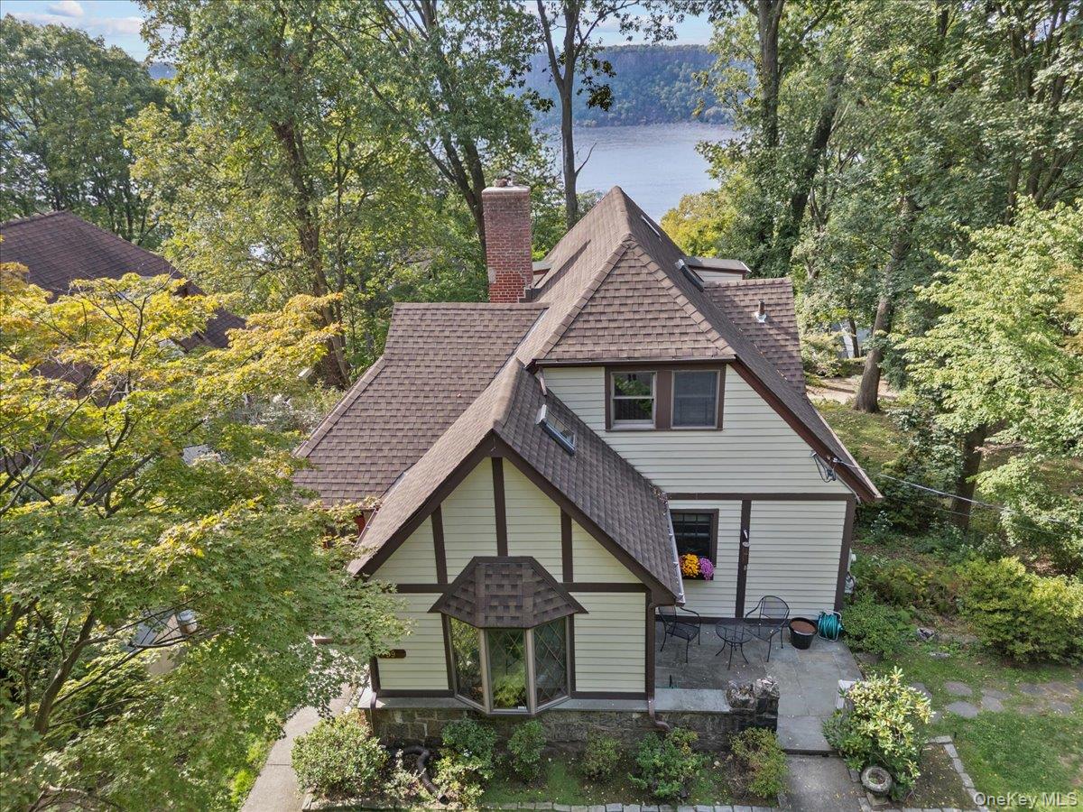 Perched above the Old Croton Aqueduct with picturesque, year-round Hud...