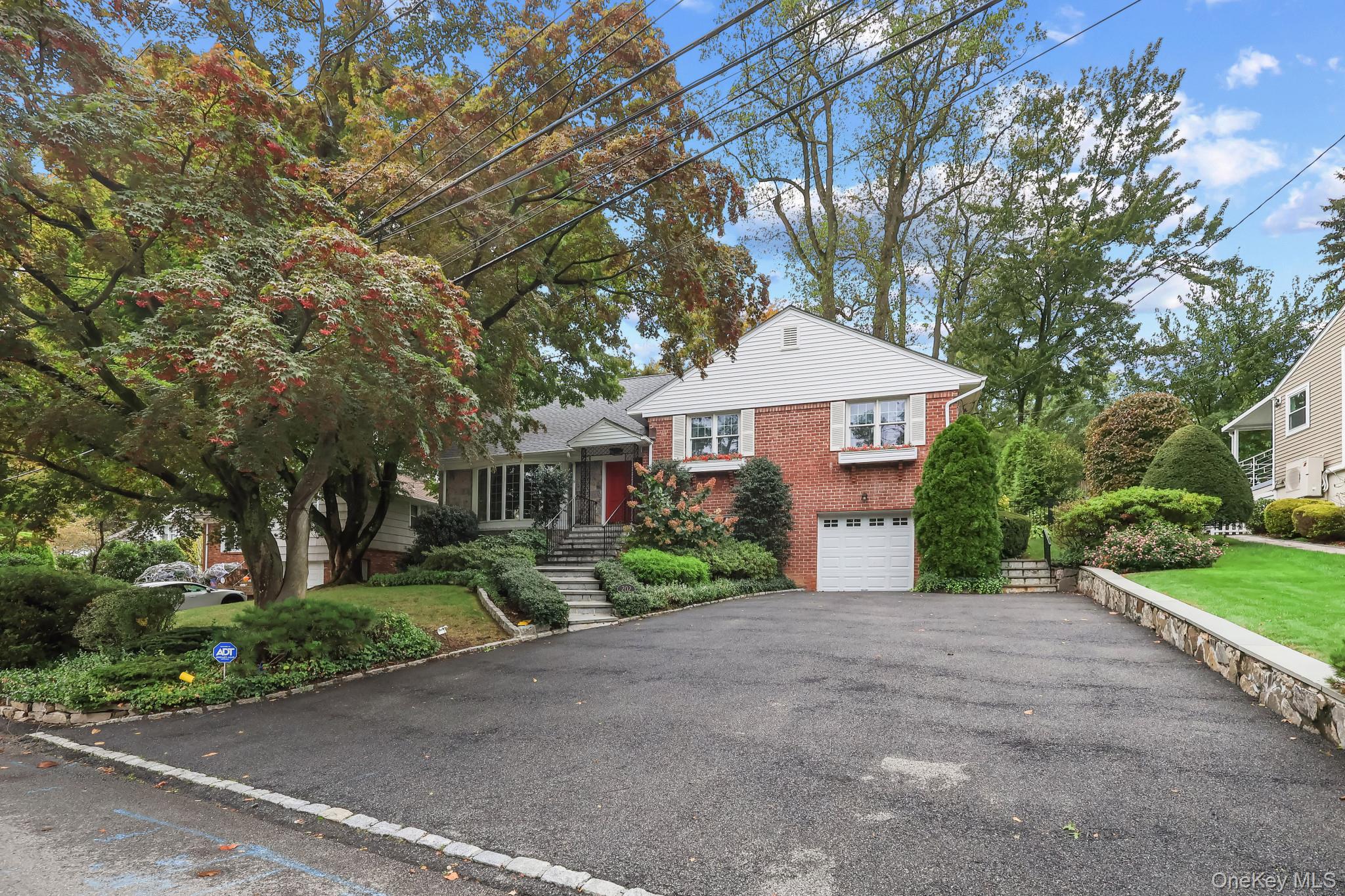 Welcome to 202 Old Wilmont Road, a wonderful split level ranch with wo...