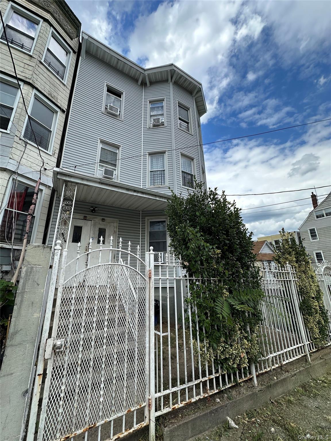 Low maintenance and well maintained legal 3 family building for sale i...