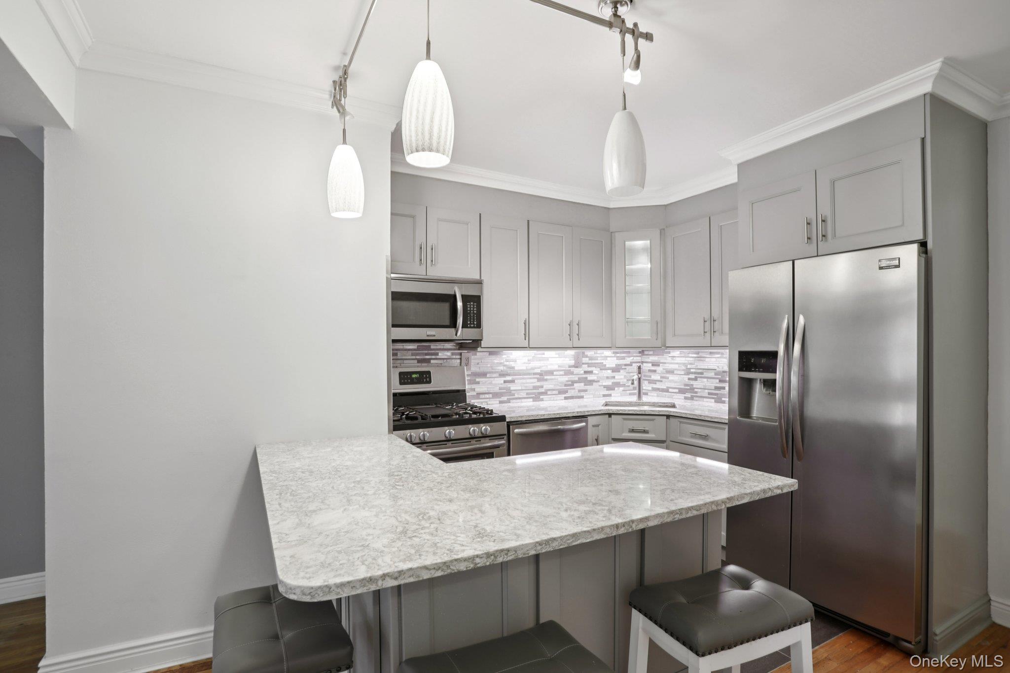 Welcome to this sun-filled top-floor one-bedroom co-op offering style,...