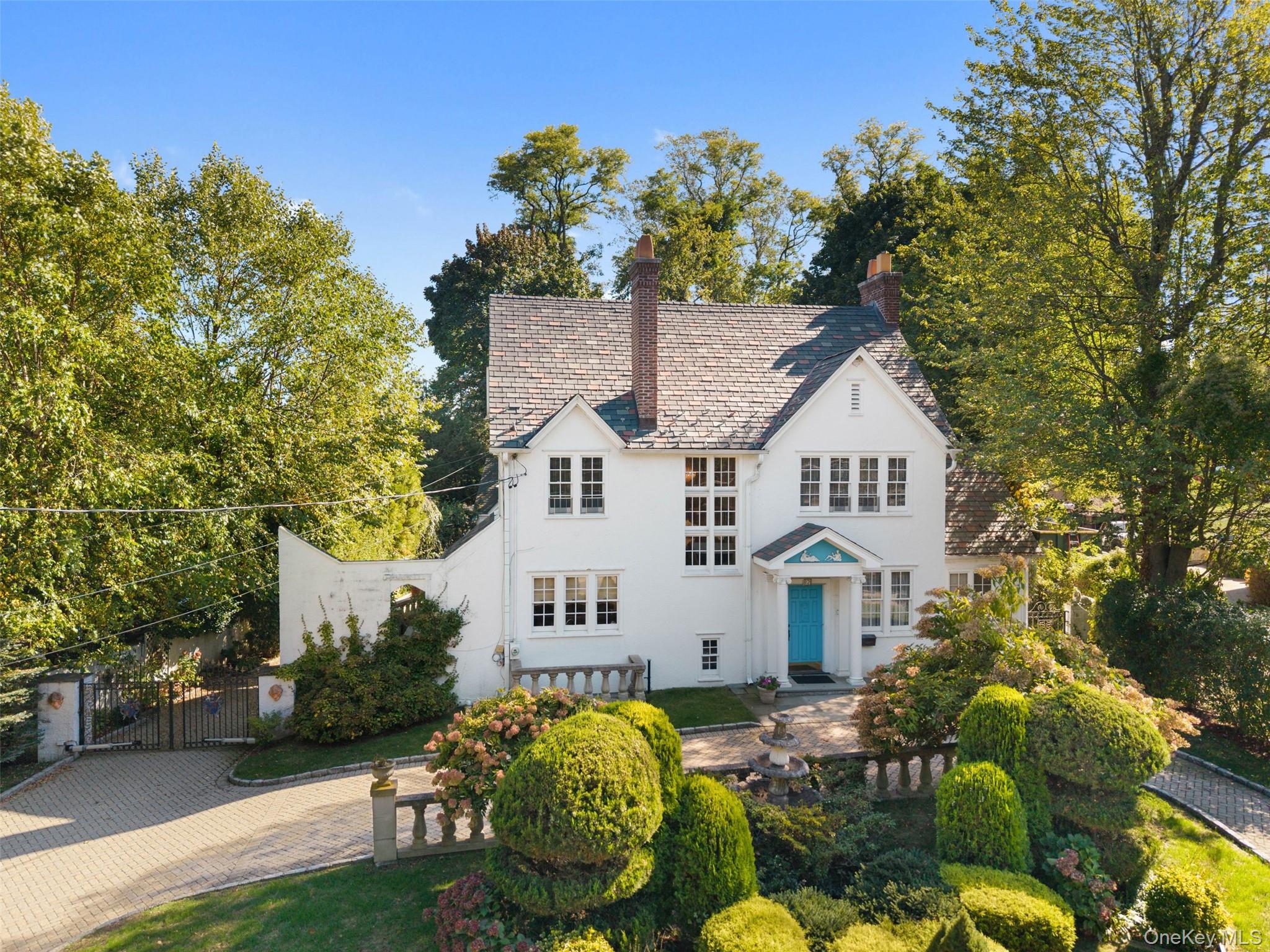 Perfectly sited on a picturesque .31-acre lot in the sought-after Tuck...