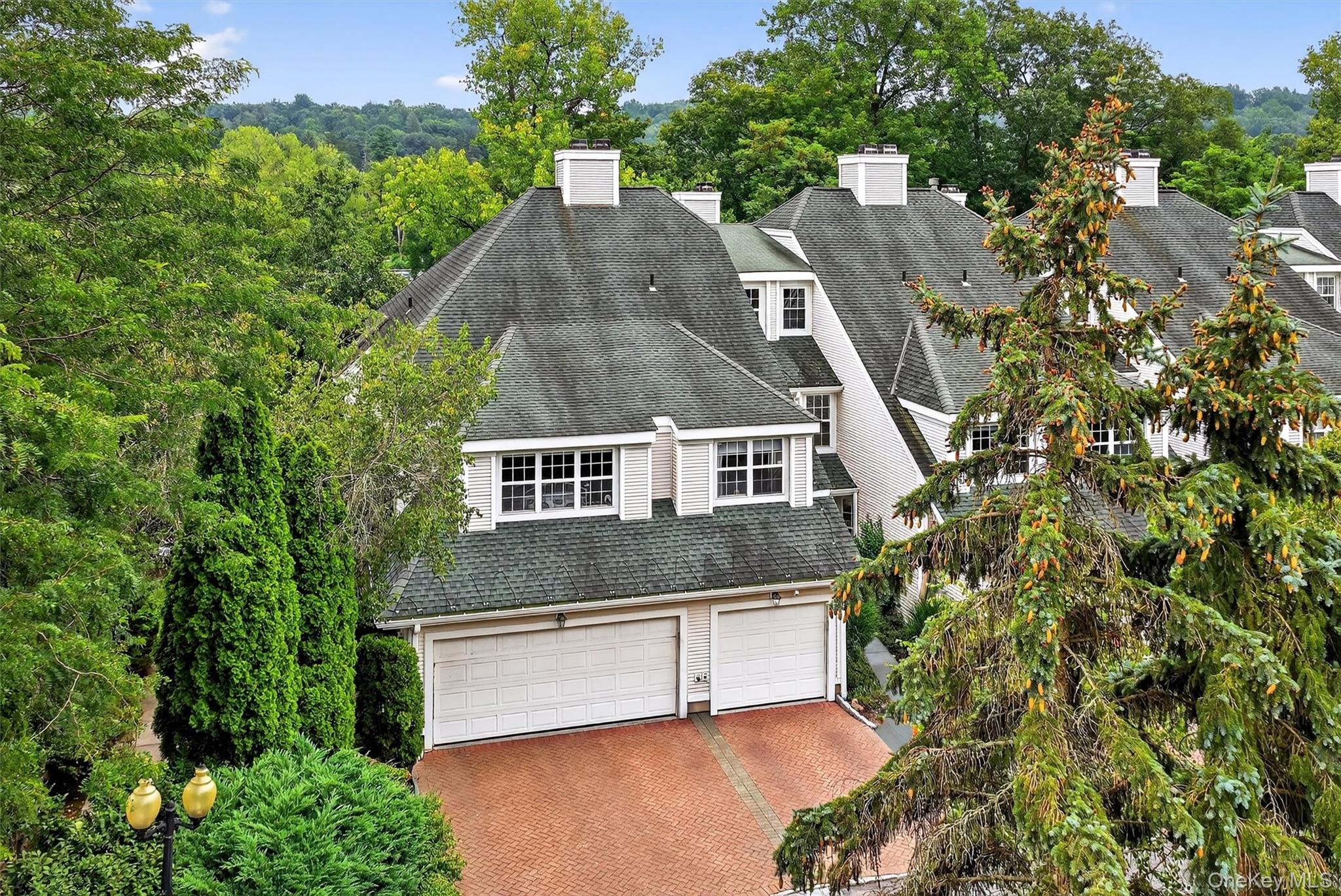 Welcome to this rare corner unit townhome in Lakeside at Bedford, one...