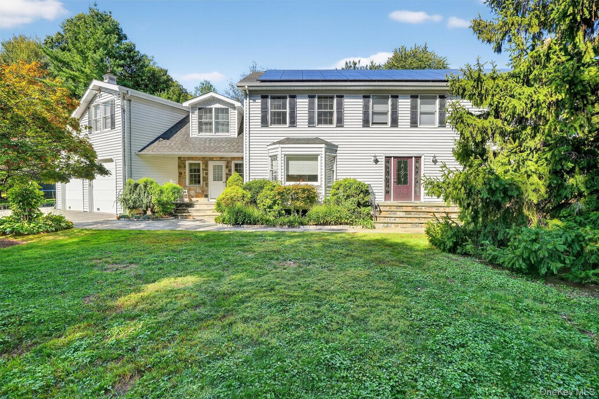 Enter through stately stone pillars and wrought iron gates to this exq...