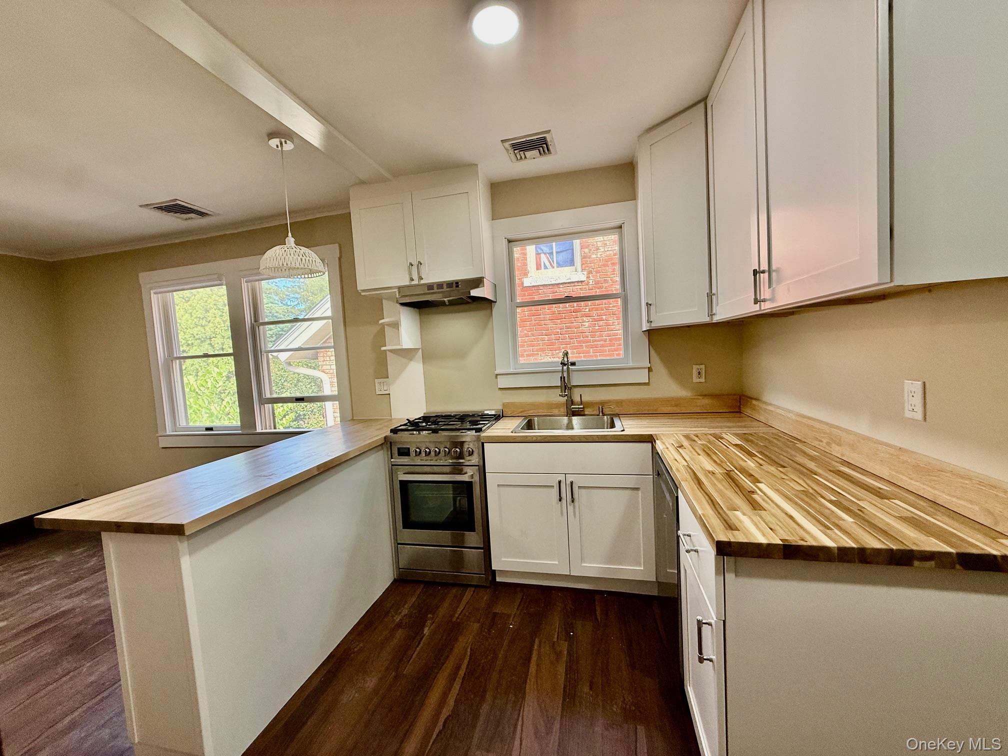 Located on one of the most peaceful corners of downtown Irvington yet...