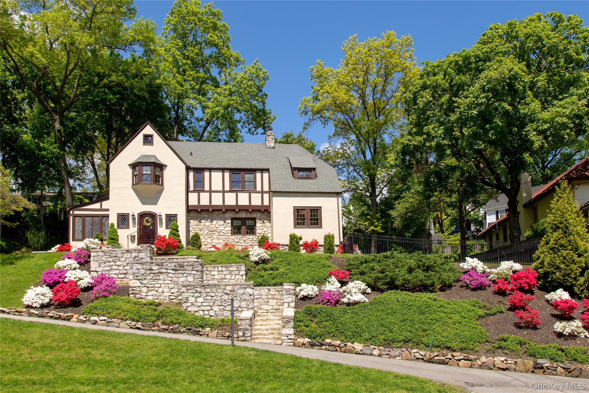 Perched gracefully above the tree lined streets of Bronxville PO's cov...