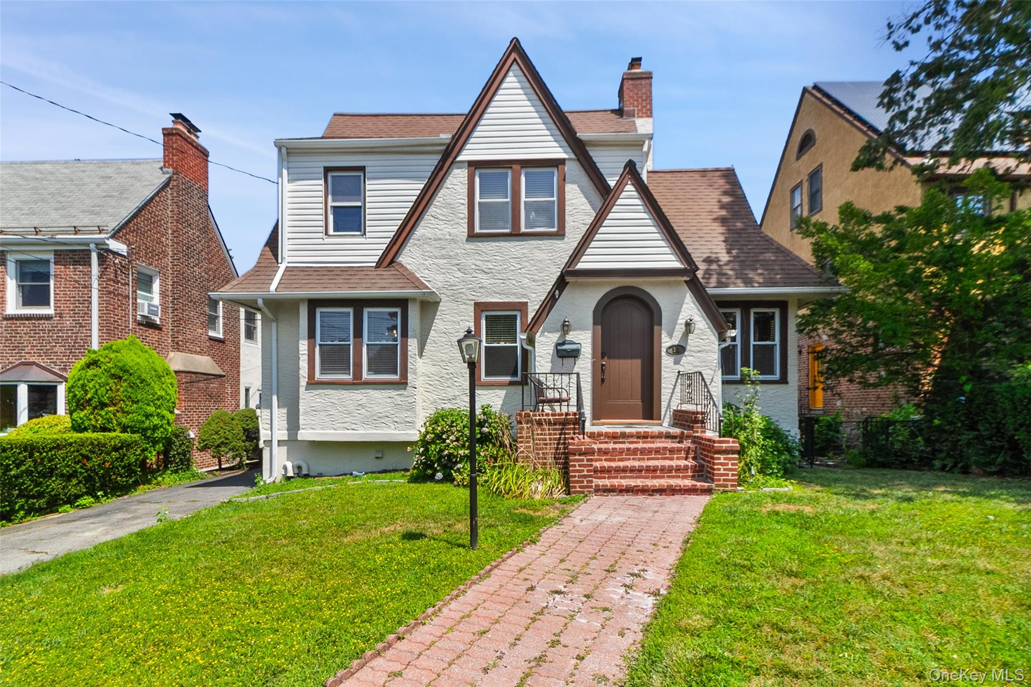 This charming 3-bedroom, 2-bathroom Tudor-style home offers approximat...