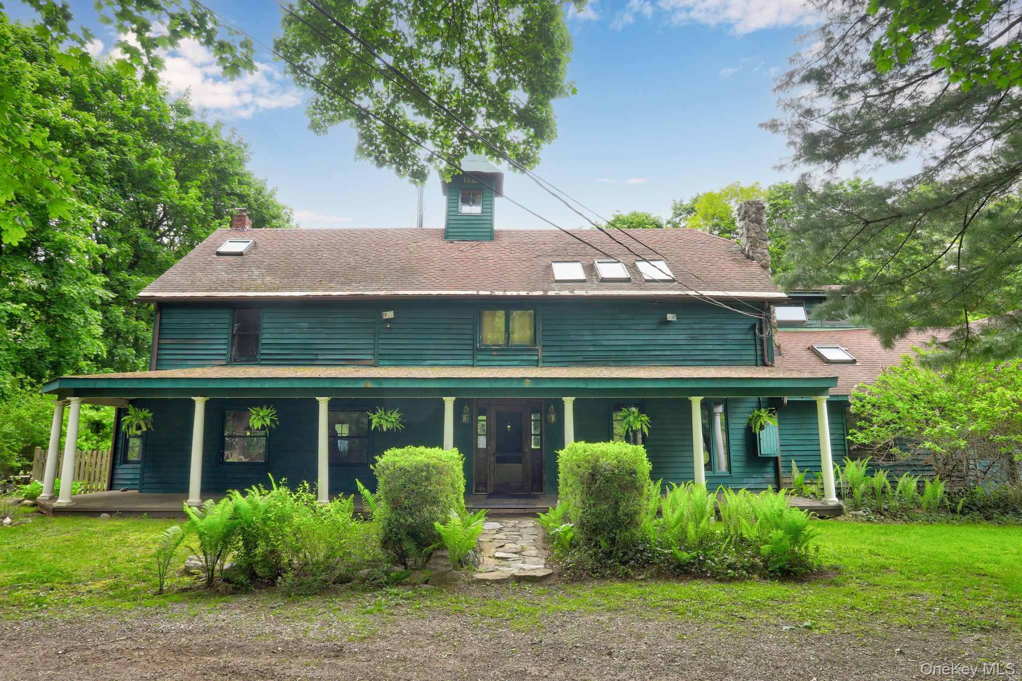 Nestled on 2 private acres and surrounded by historic 1800s rubble sto...