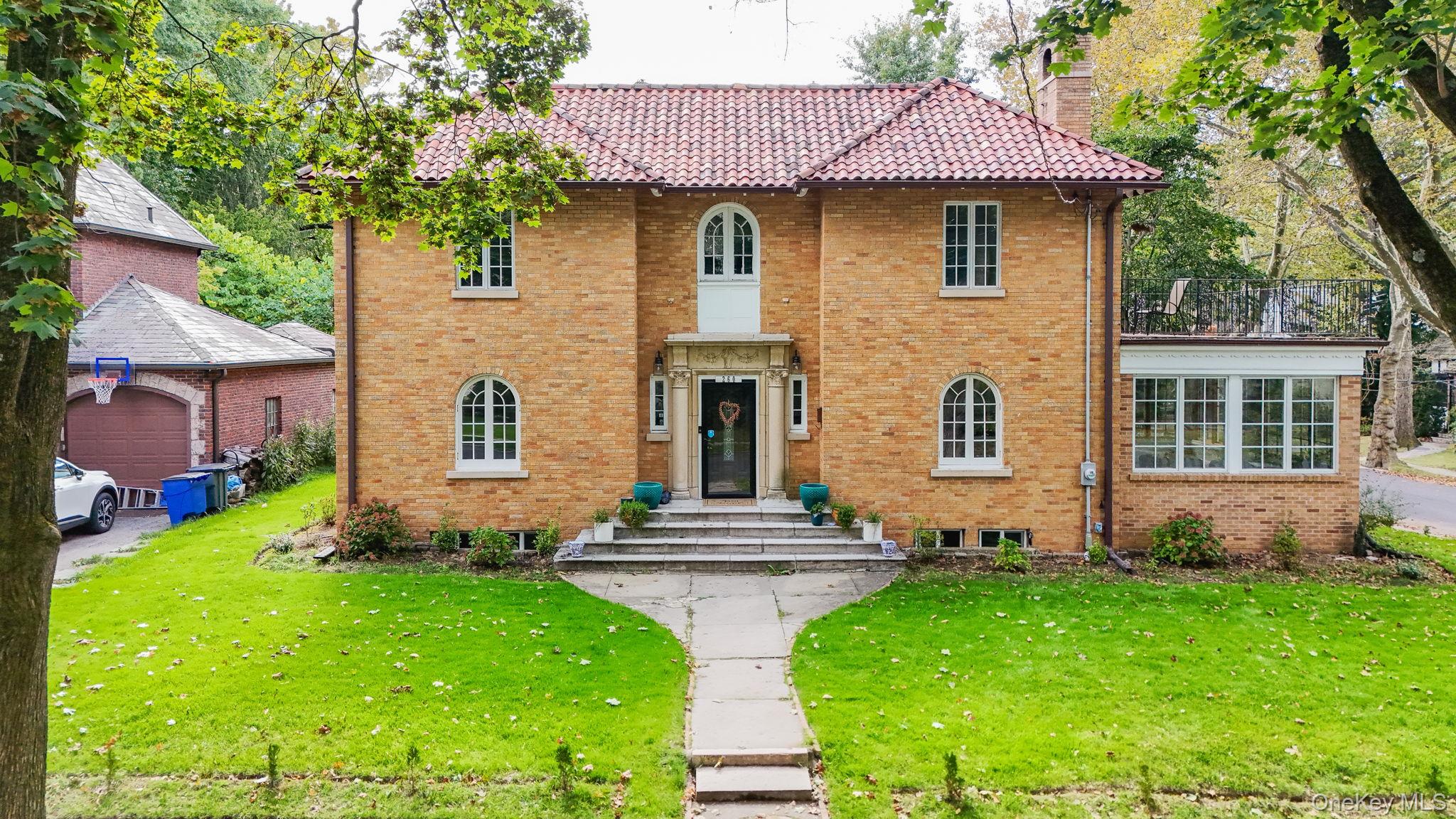 Welcome to this beautifully updated Mediterranean-style home, where ti...