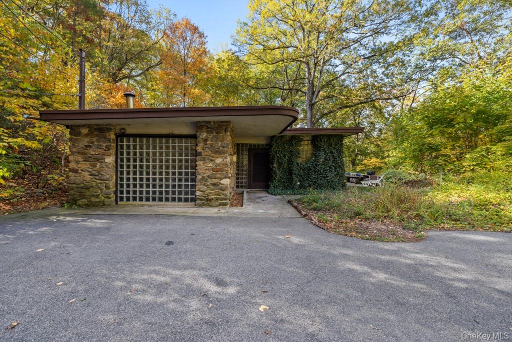 Set on more than 4 serene wooded acres, this architectural gem offers...