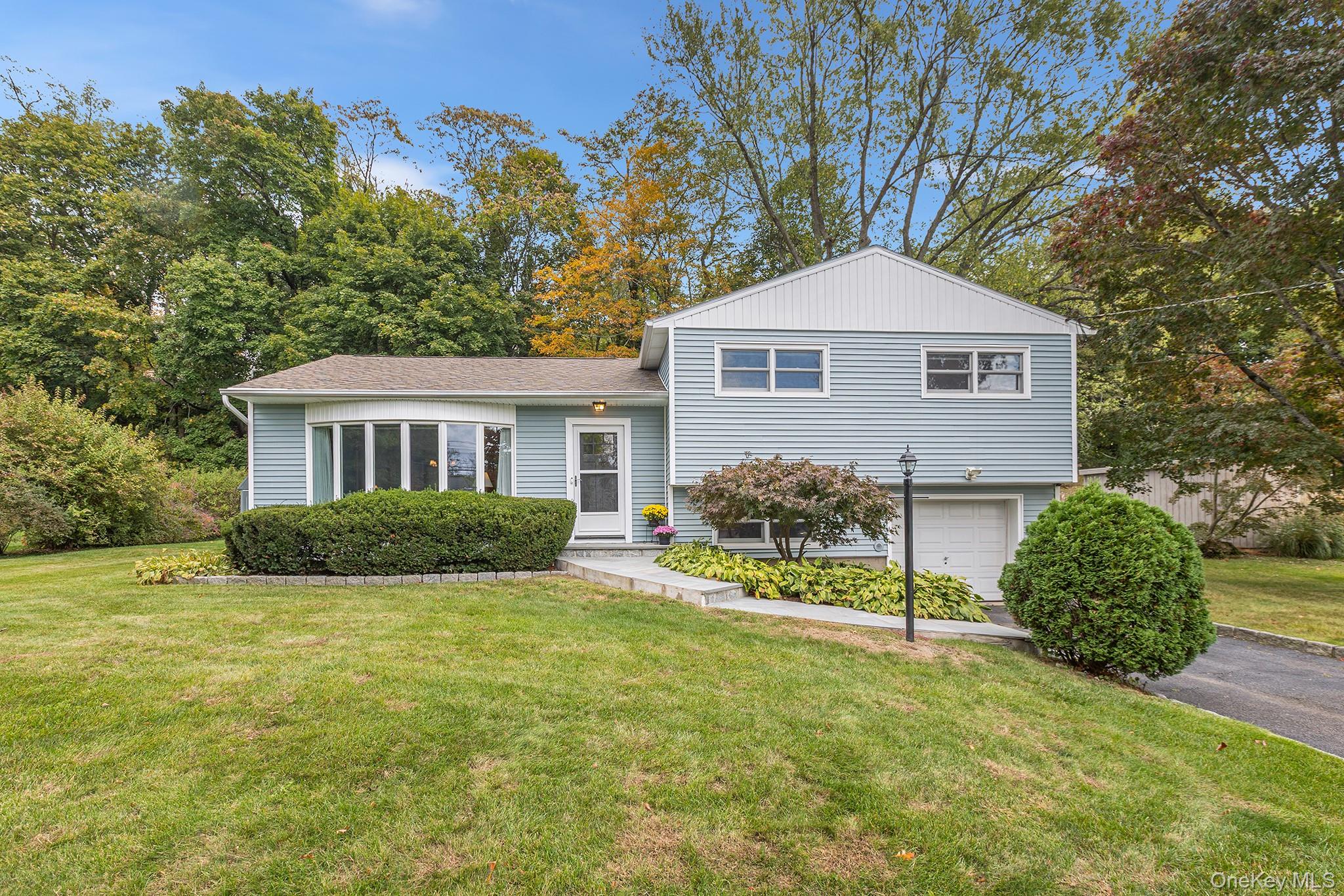 Located along a peaceful cul-de-sac in Ossining, there is a quiet grac...