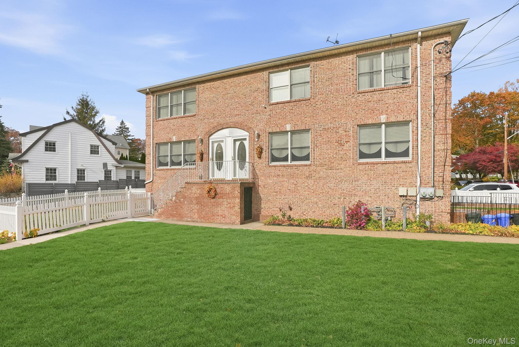 Welcome to this charming all-brick two-family home located in one of Y...
