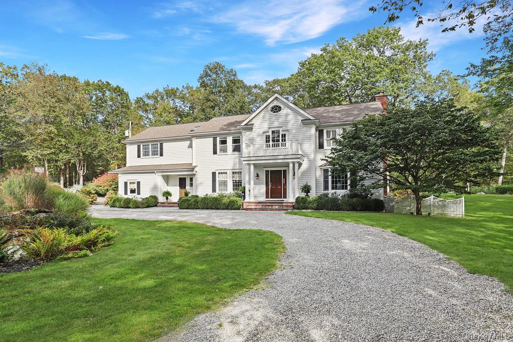 Perfectly sited at the end of a quiet cul-de-sac, this Pound Ridge res...