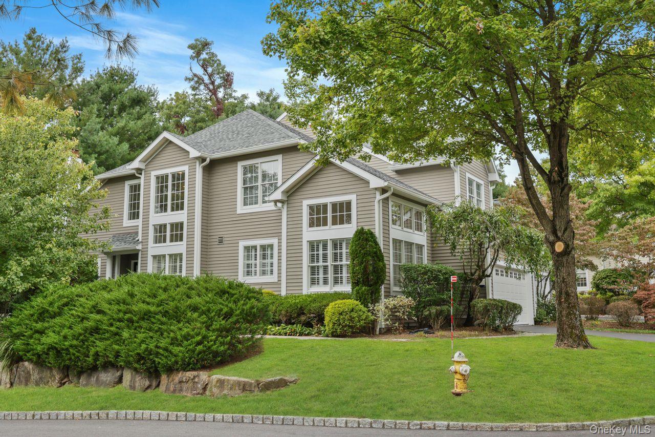 Nestled on a distinguished corner lot within the prestigious gated com...