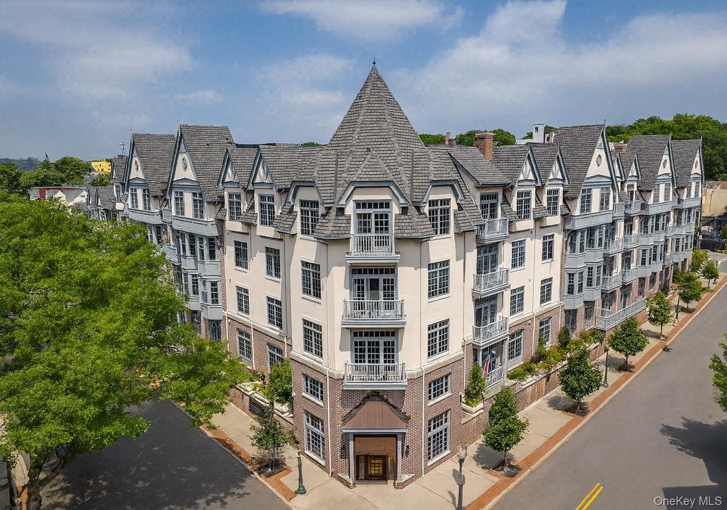 Experience refined living at Marbury Corners, a Tudor-inspired condomi...