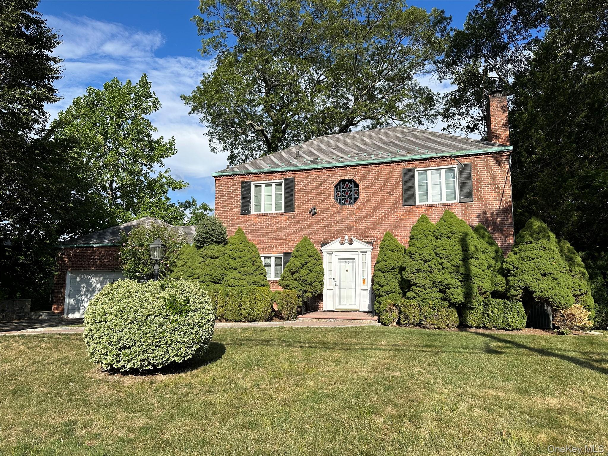 This stately 1930's brick Colonial is located in the prestigious Beech...