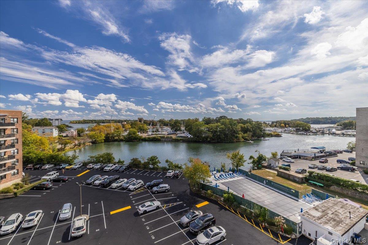 Stunning water views of Long Island Sound! This sun-filled corner unit...