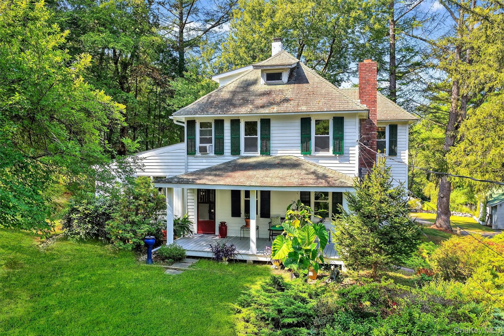 In the Hamlet of Huntersville, this picturesque circa 1920 farmhouse s...