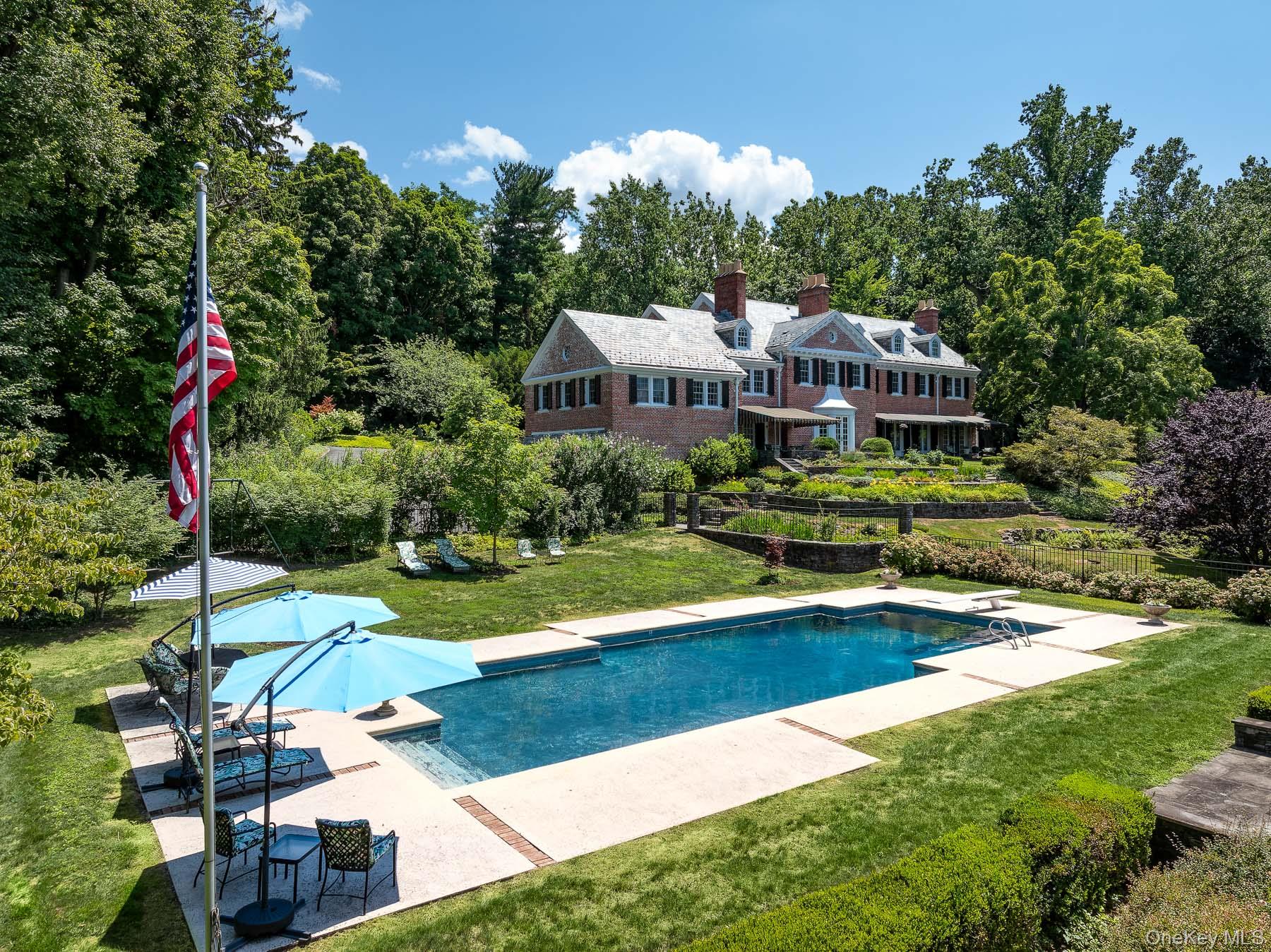 Handsome  brick Georgian Colonial set on three and half acres in Irvin...