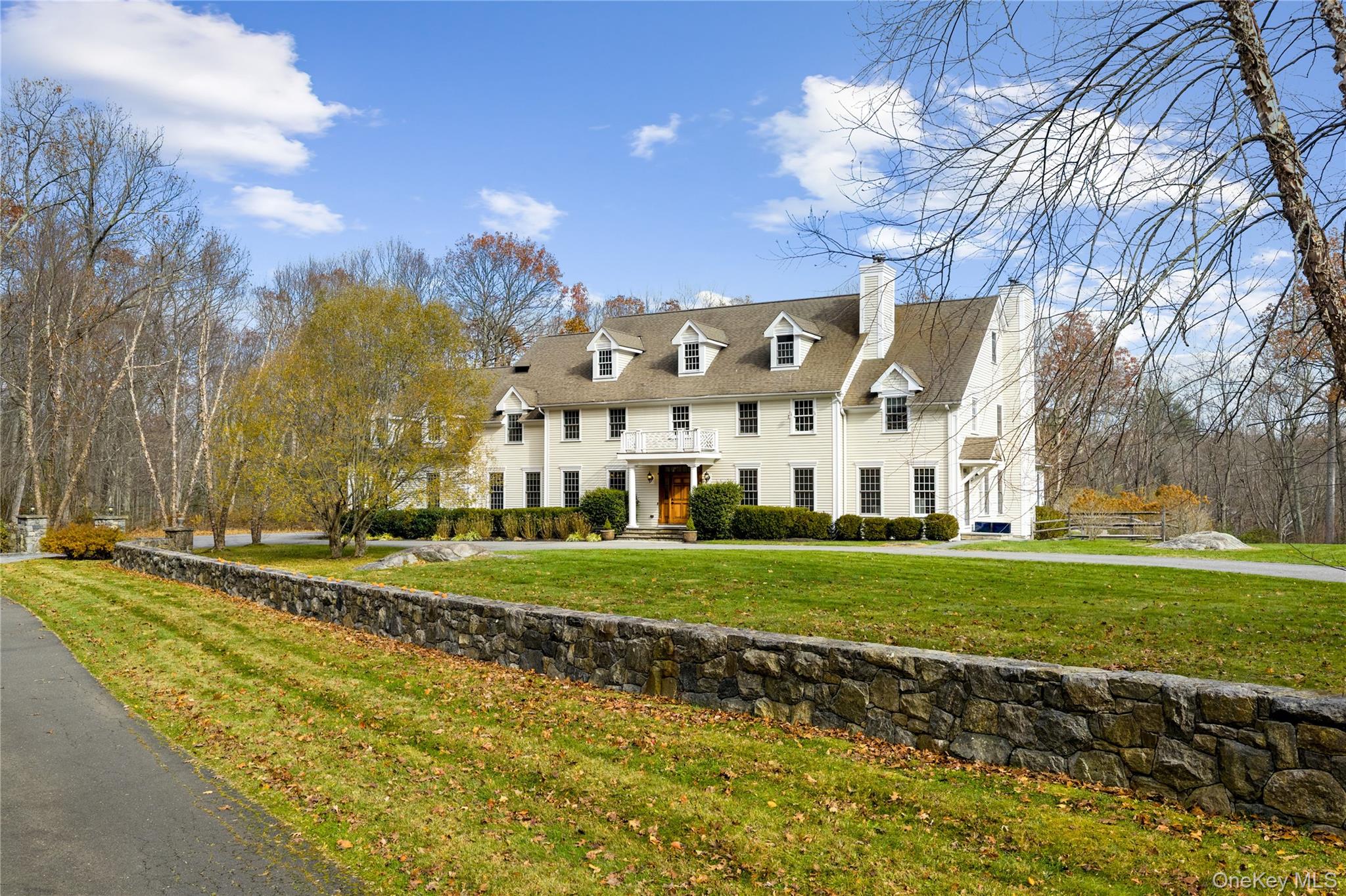 Set on over two spectacular acres in a premier location in Pound Ridge...