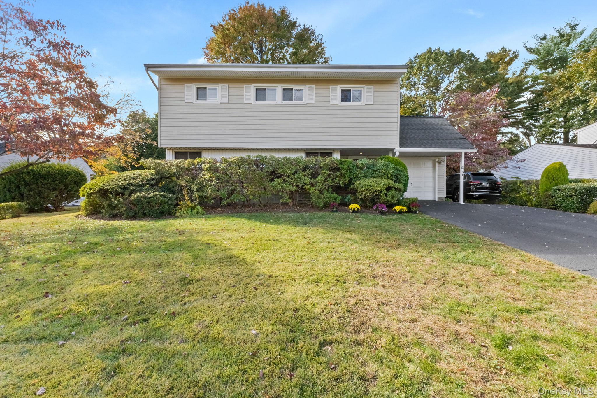 A Gem! This colonial offers a semi-open floor plan with beautiful wood...