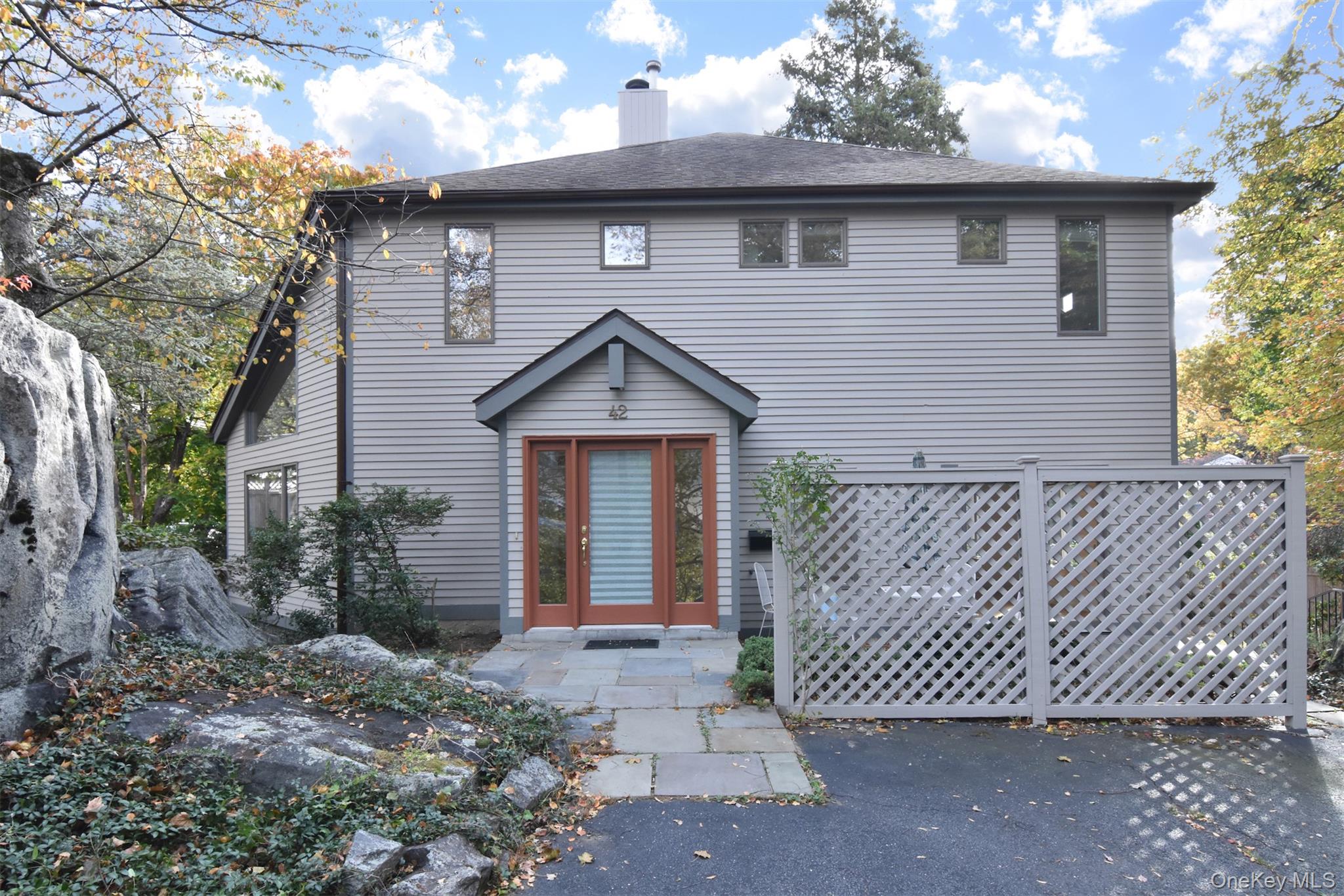 Tucked away behind natural rock outcroppings, this stunning light fill...