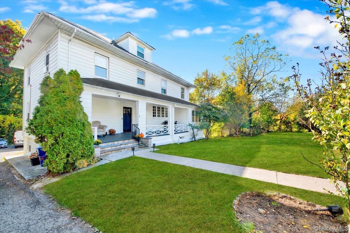 Welcome to this distinguished 1910-built Colonial situated on a genero...