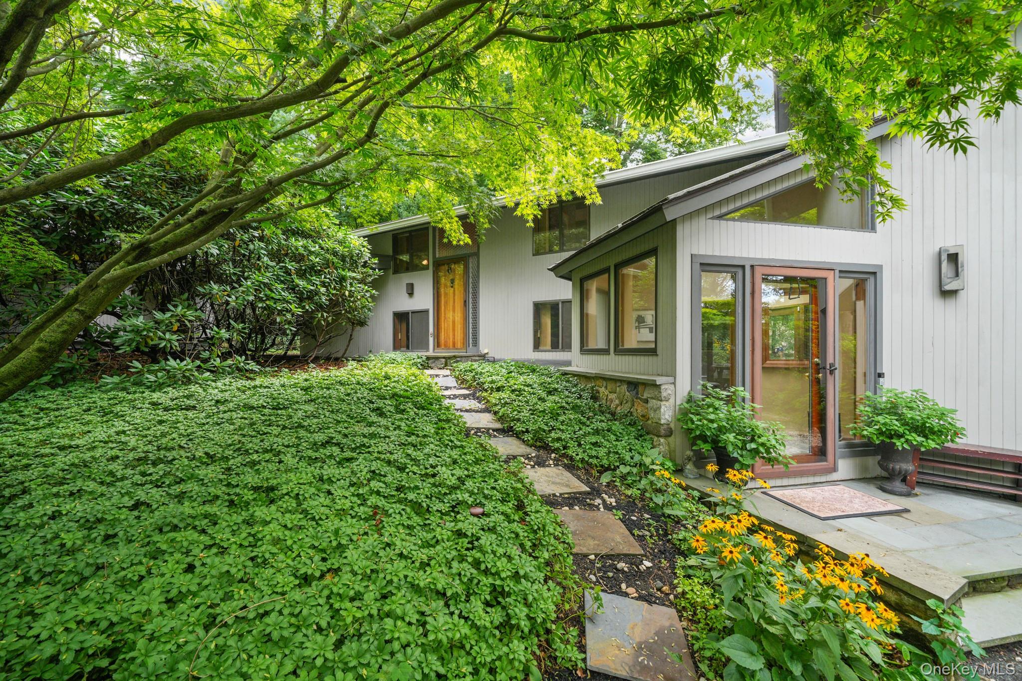 Mid-Century Modern elegance meets cottage-core charm in this architect...