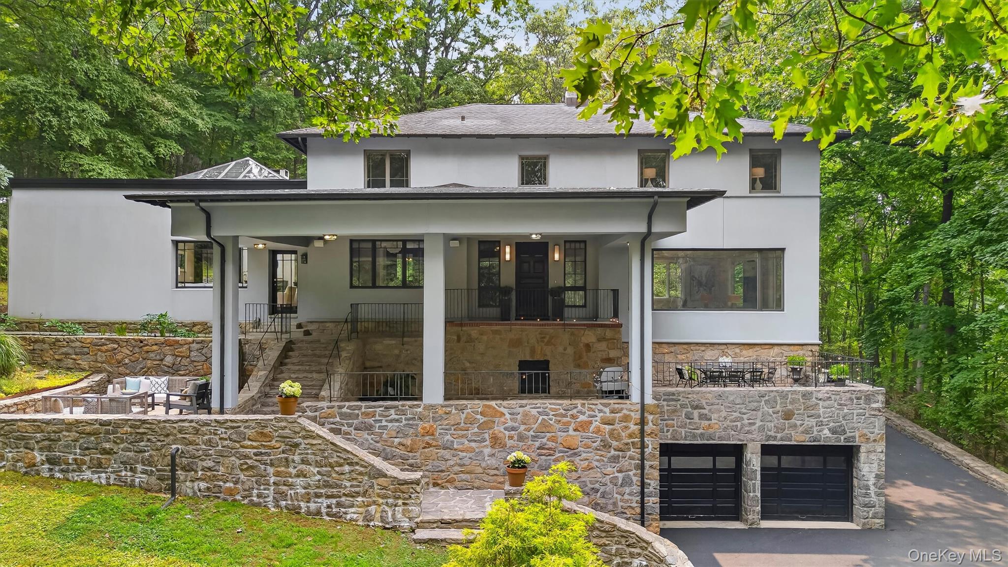 Set on an extraordinary 3.45-acre property surrounded by mature trees,...