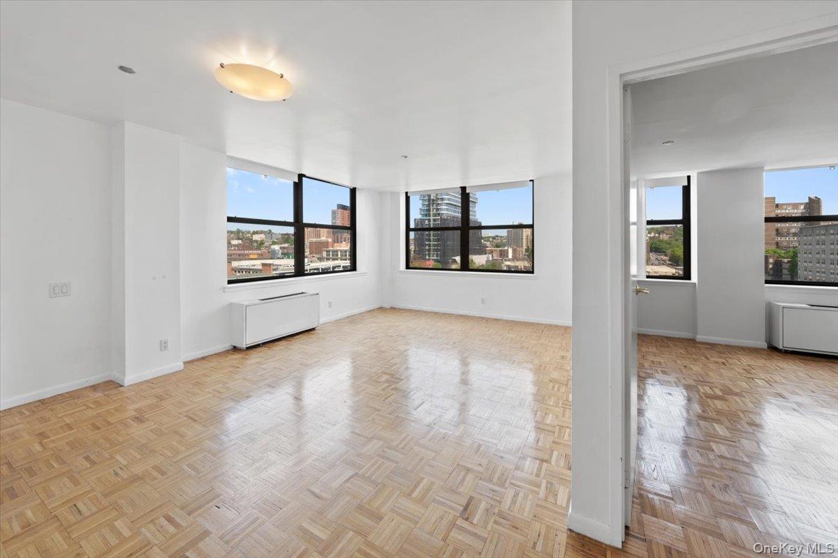 CITY VIEW FROM EVERY ROOM | Enjoy Refined Living in this Bright One Be...