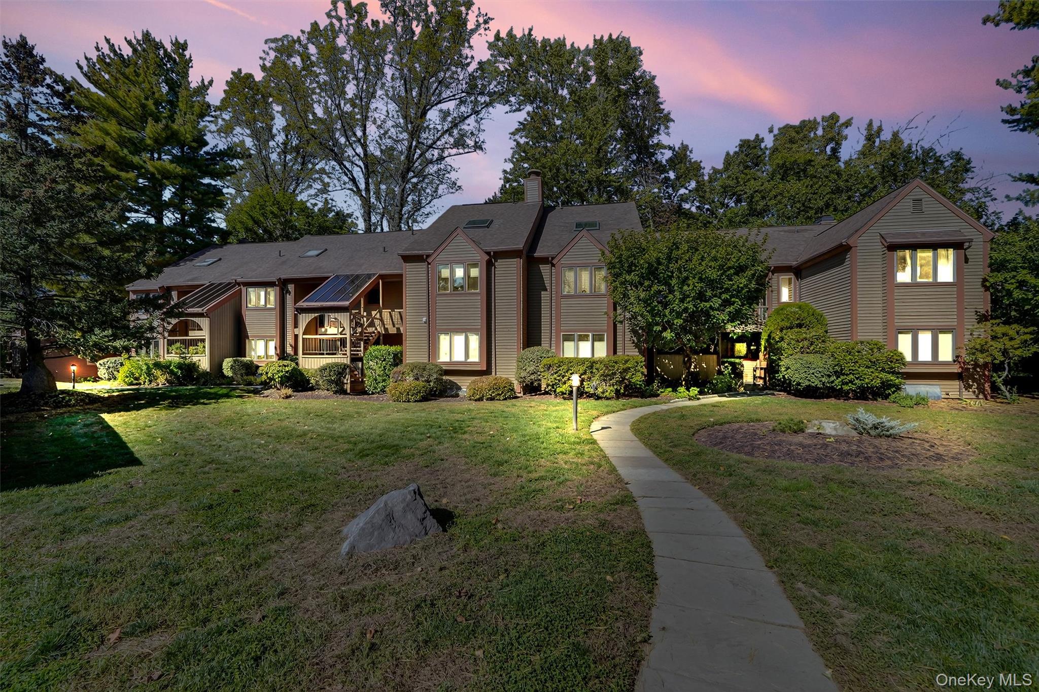 Eagle Bay!  Discover serene living in this first floor - no steps - 1...