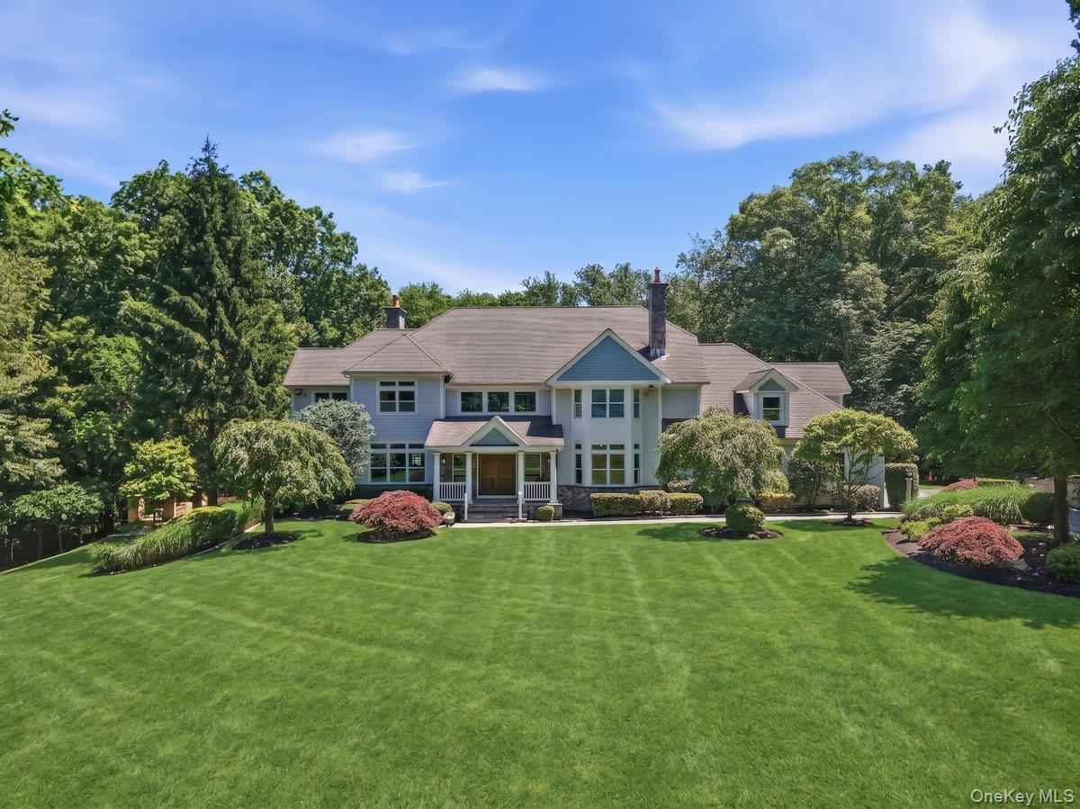 Beyond private gates in coveted Back Country Bedford, this exceptional...
