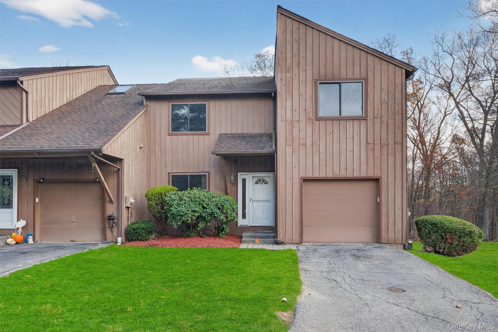 Welcome to this rare tri-level, walk-out end unit at Wild Birch Farms...