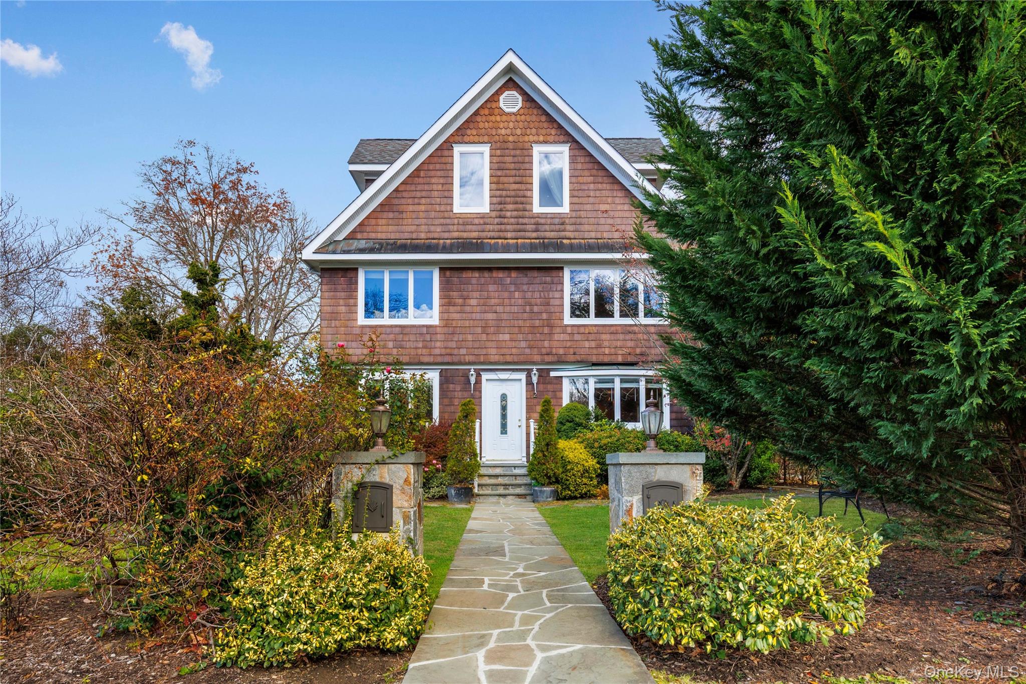 Welcome home to this spacious and sun-filled four-bedroom, two-bath du...