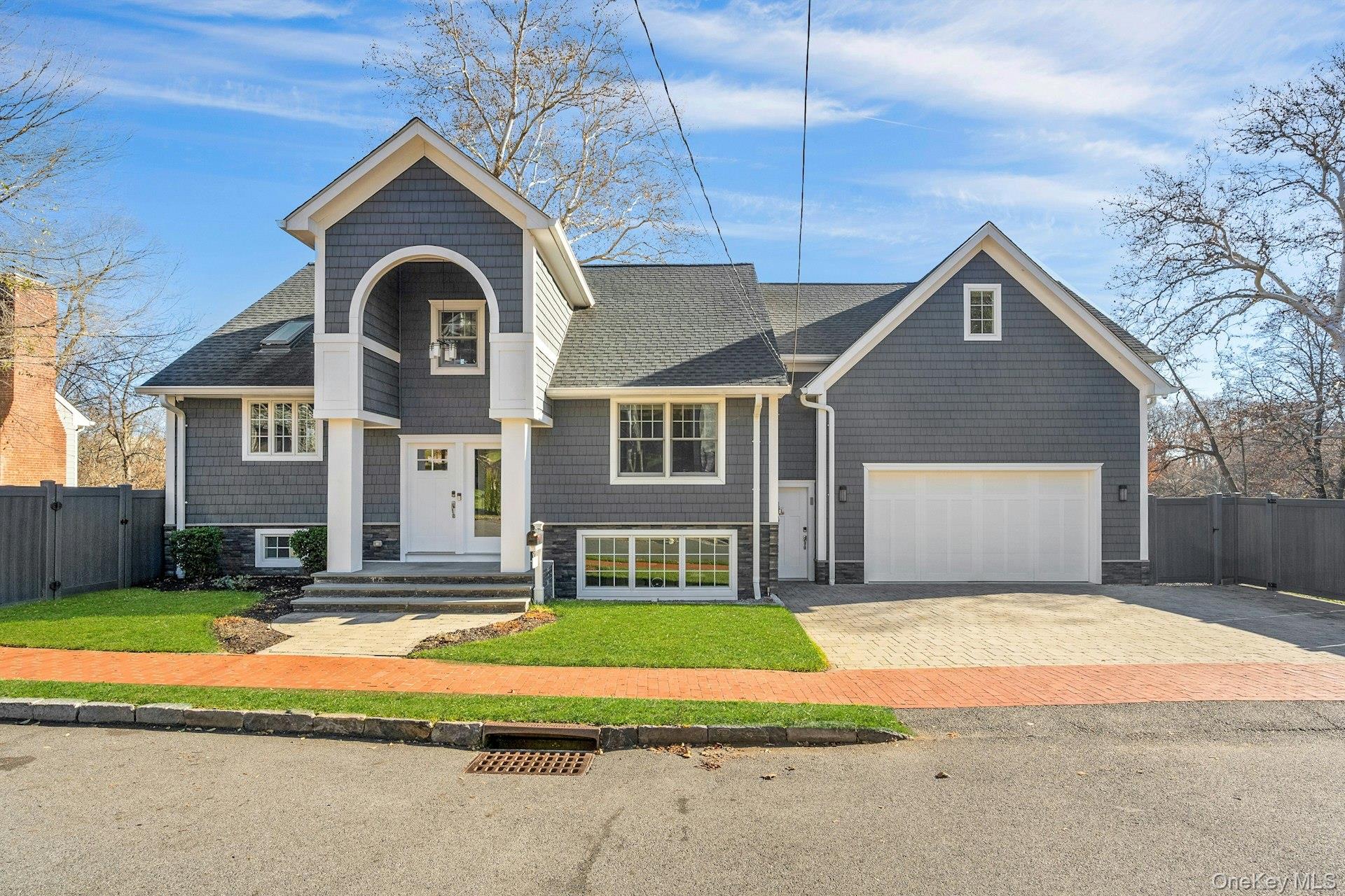 A rare offering just moments from the Scarsdale train station, this tu...