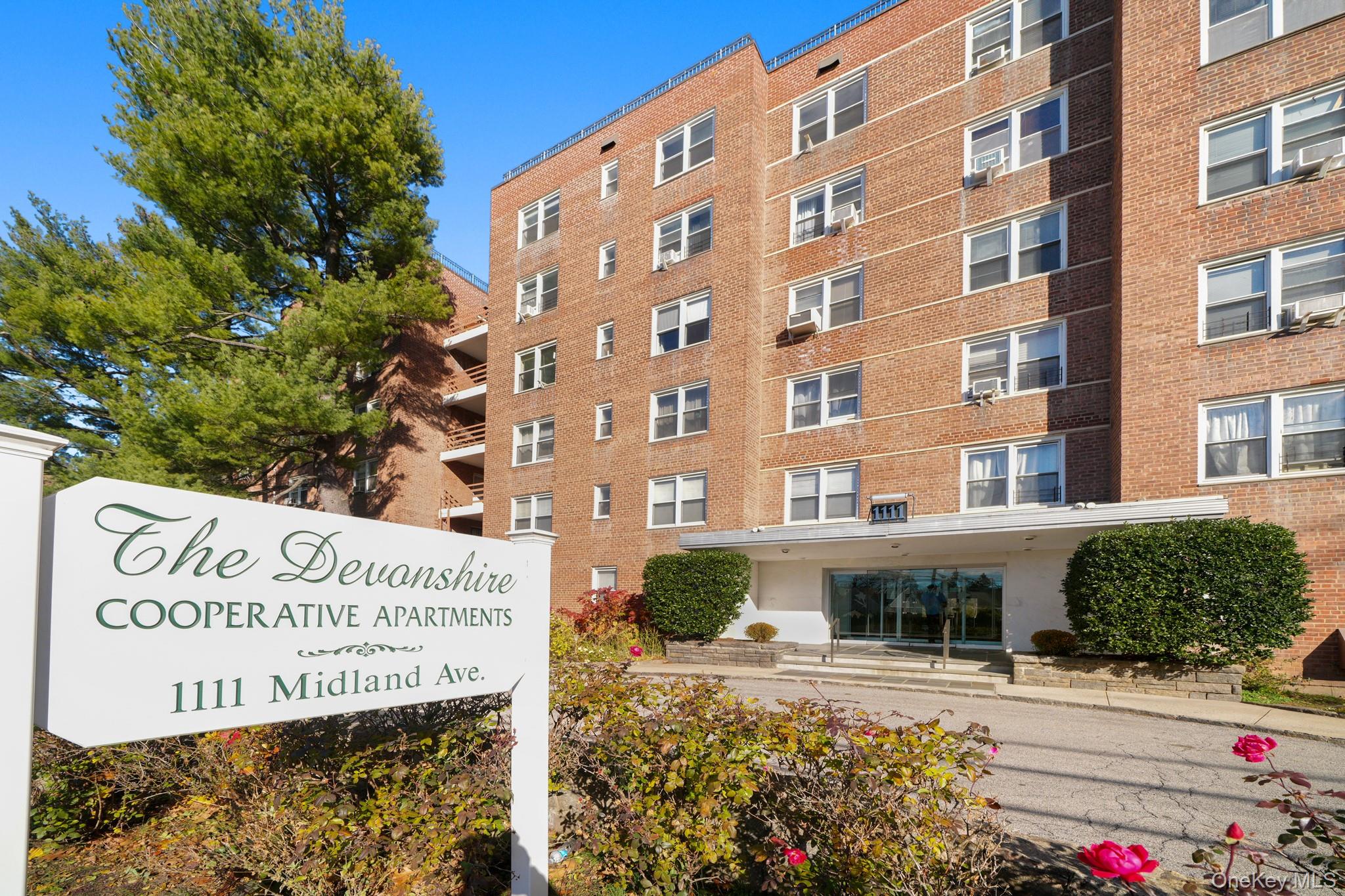 Welcome to 1111 Midland Avenue, Unit 1P—a fully renovated studio co-op...