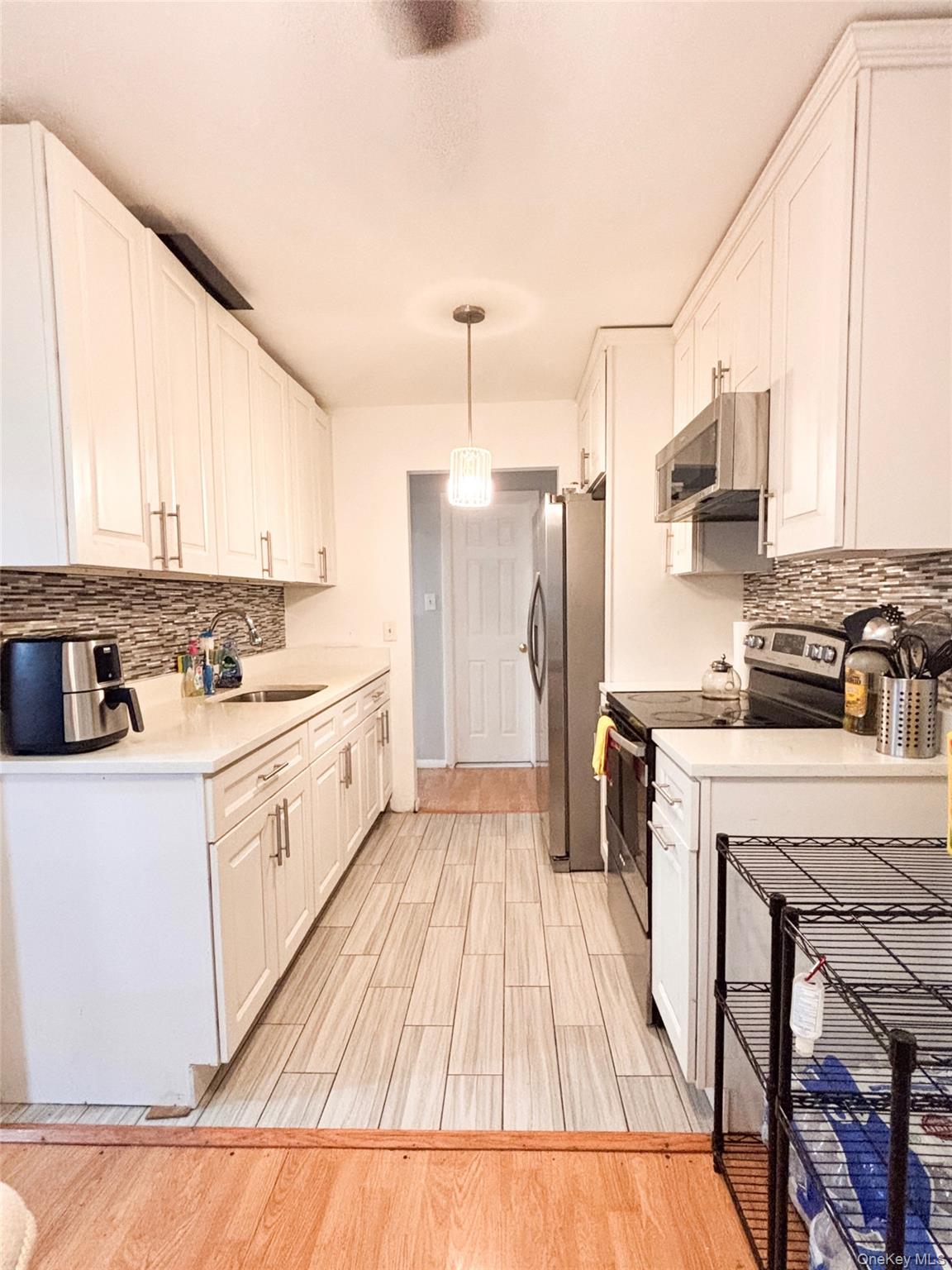 Spacious and bright first-floor 1-bedroom, 1-bath garden-style condo i...