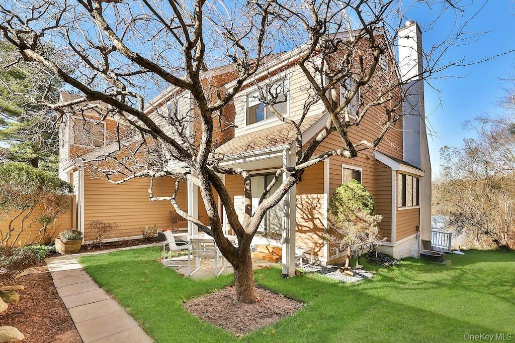 Beautifully updated townhome overlooking a picturesque lake with a pri...