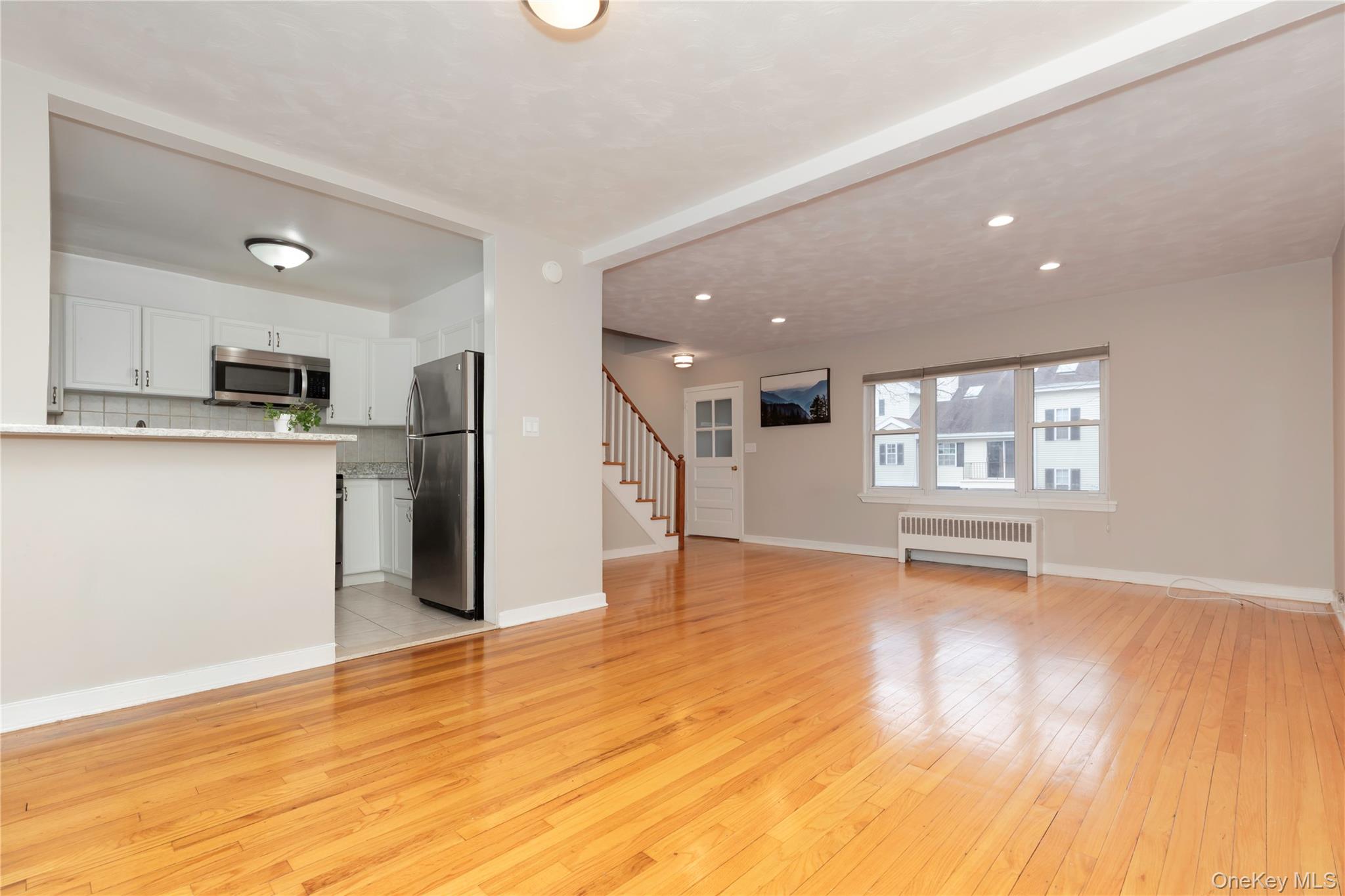 Welcome home to this bright and welcoming two-bedroom, one-bath corner...