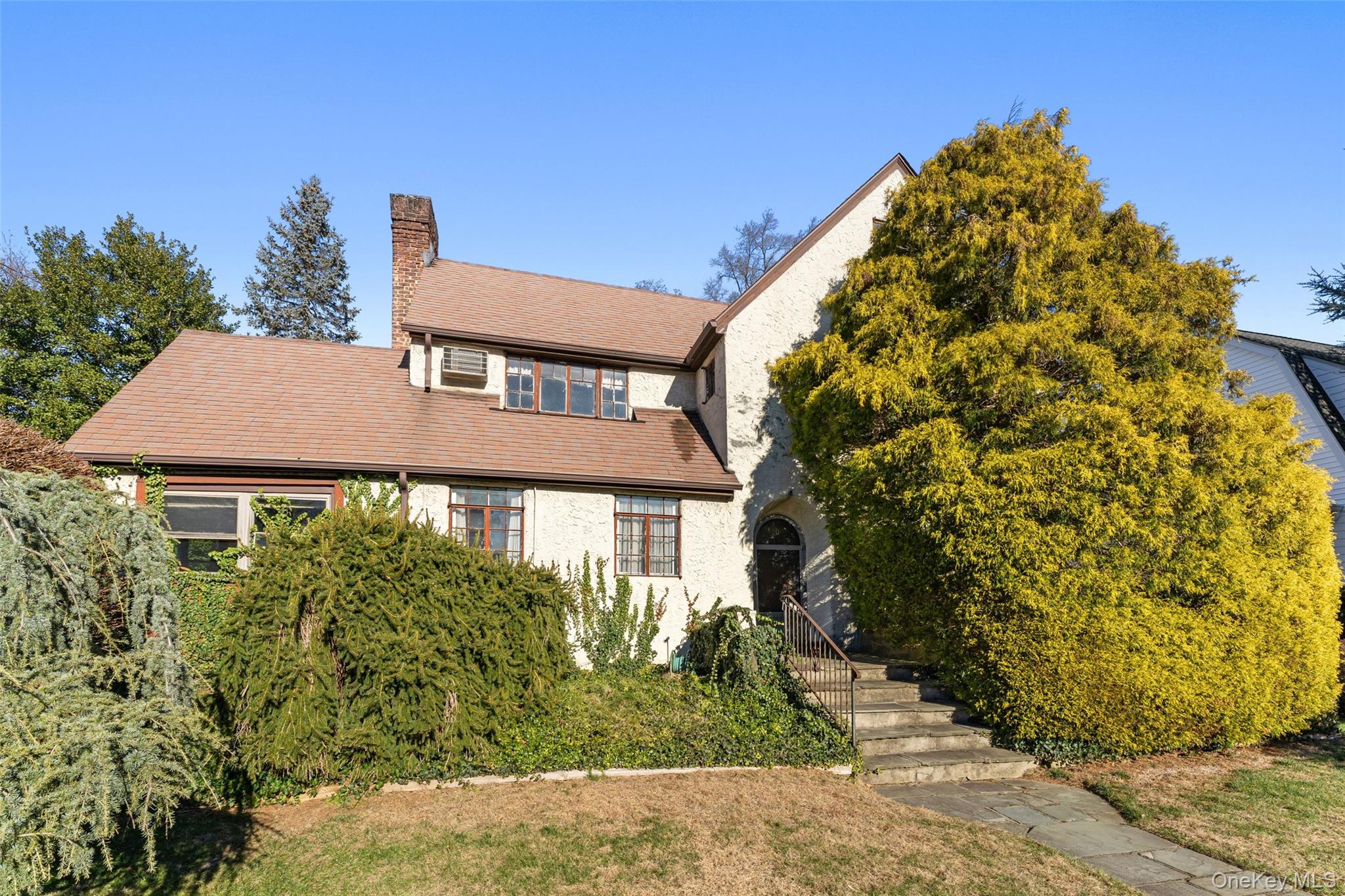 Brimming with character and opportunity, this 1928 Tudor residence is...